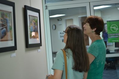 Women looking at art.