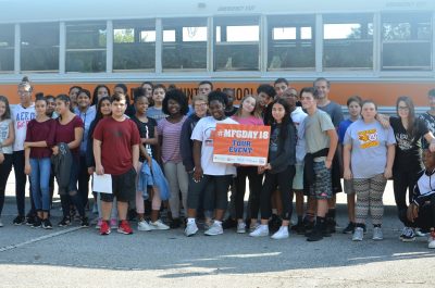 Large class of students pose for a National Manufacturing Day 2018 photo.