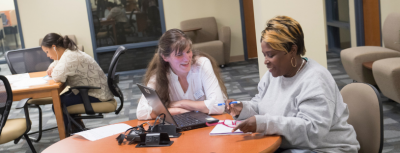 Student receiving help from a tutor.