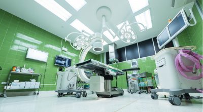 Hospital Operating room with green tile walls and white equipment