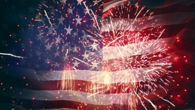American Flag with Fireworks in foreground
