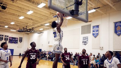 Storm Basketball Player Number 33 dunks basketball during game