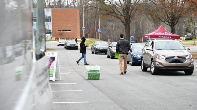 Cars lined up for free medicine giveaway event