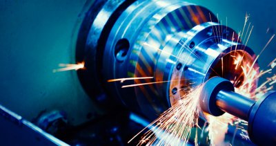 Close up of machining parts with sparks flying