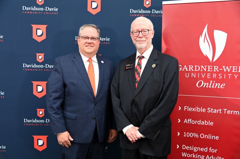 Davidson-Davie’s Dr. Darrin Hartness and Gardner-Webb’s Dr. Ben Leslie following the signing.