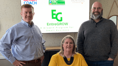 Three small business leaders in front of origination logos on screen