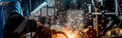 Welder with sparks flying