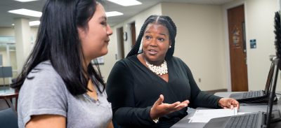 Advisor explaining something to a student