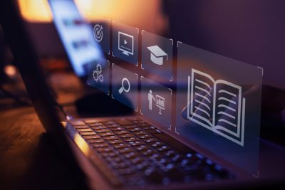 Digital images floating above computer keyboard