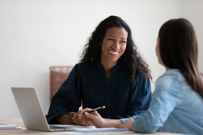 student being advised with laptop open
