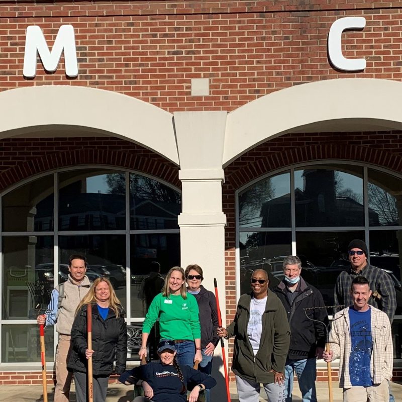 A team of Davidson-Davie volunteers, pictured with Jen Fuller-Allen, CEO of the J. Smith Young YMCA, worked on a variety of projects at the Y, including landscaping, pressure washing, and cleaning buses