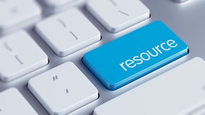 White computer keyboard with blue button labeled "resource".