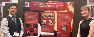 Undergraduate Research students stand in front of presentation display