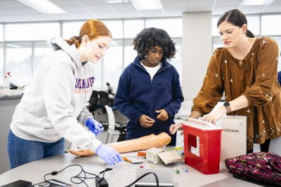Medical Laboratory Technology Students With Instructor.