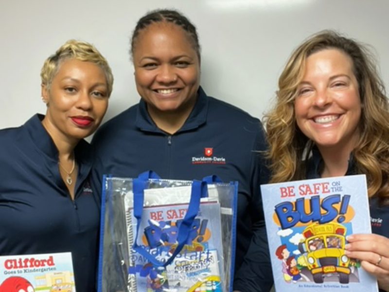 Keisha Jones, Jasmine Hargrave, and Laura Yarbrough who volunteered to create "Transition to Kindergarten" bags at Smart Start of Davison County.
