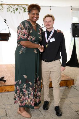 From left to right are Dr. Dee Stokes with Davis Norton, who took the top prize at the Young Entrepreneurs Summit.
