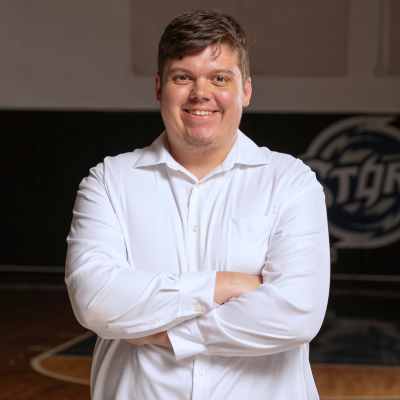 Storm Volleyball Manger wearing white dress shirt