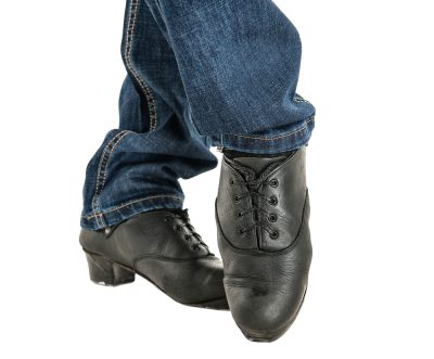 Black shoes in the stance of Céilí Irish Dancing