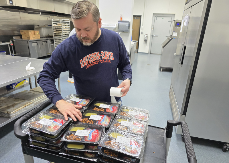 Brian De Young prepares and packages ready-made dinners at Hopefulls, Inc. (Wallburg)