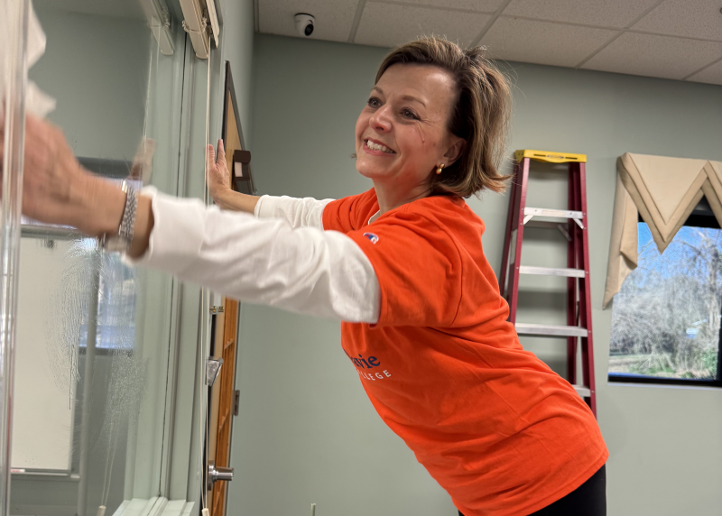 Maria Zimmerman washing windows at The Life Center (Lexington)