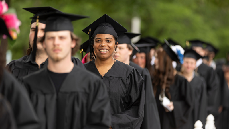 Smiling Davidson-Davie Graduate in Cap and Gown