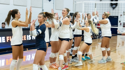 Davidson-Davie volleyball team high five huddle.