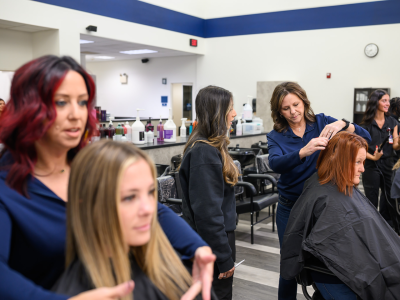Stylists working with clients in a modern hair salon.