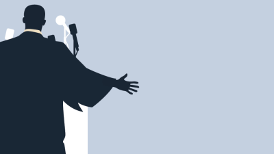 Silhouette of Martin Luther King, Jr. behind a podium with microphones, extending an arm outward.