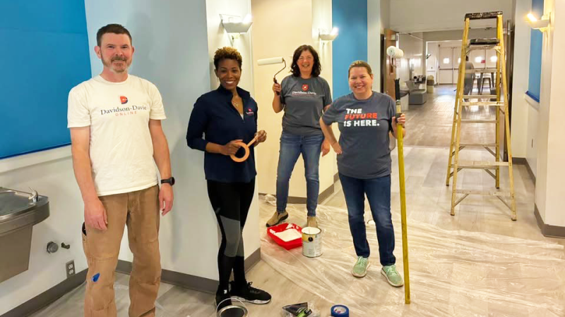Faculty & Staff painting a hallway at J. Smith Young YMCA in Lexington.