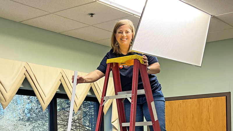 Staff changing lightbulbs at the Life Center of Davidson County.