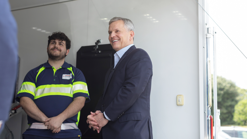 North Carolina Governor Josh Stein speaks with student while touring the mobile labs.