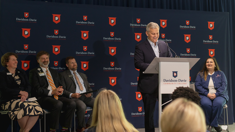 North Carolina Governor Josh Stein speaks at Davidson-Davie from podium.