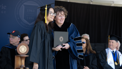 Davidson-Davie Community College President, Jenny Varner, presents student with degree.